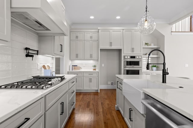 1825 River Breeze Dr, Soddy Daisy, TN 37379 - kitchen with premium range hood, ornamental molding, appliances with stainless steel finishes, hanging light fixtures, and dark wood-style flooring