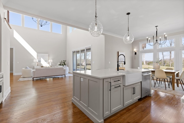 1825 River Breeze Dr, Soddy Daisy, TN 37379 - kitchen with a wealth of natural light, a notable chandelier, light wood-style flooring, and a sink