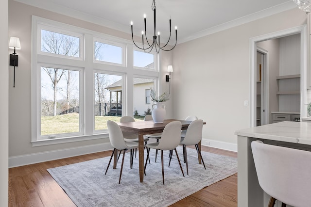 1825 River Breeze Dr, Soddy Daisy, TN 37379 - dining area featuring crown molding, a notable chandelier, wood finished floors, and baseboards