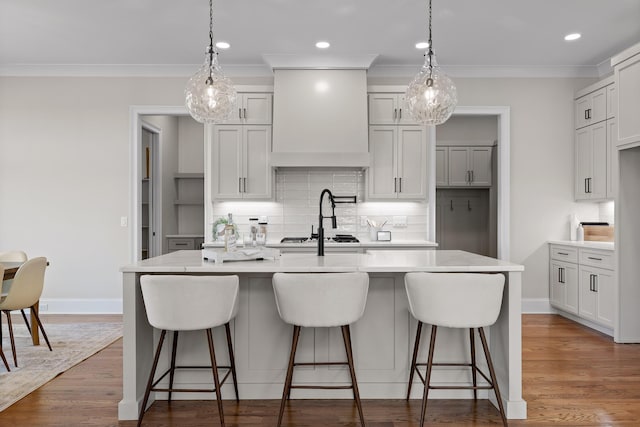 1825 River Breeze Dr, Soddy Daisy, TN 37379 - kitchen featuring custom exhaust hood, light countertops, and wood finished floors