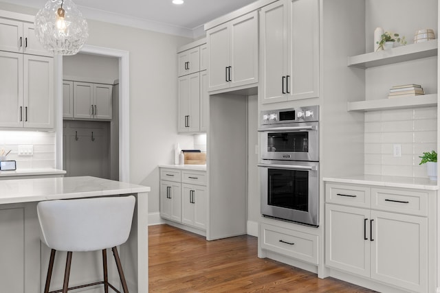 1825 River Breeze Dr, Soddy Daisy, TN 37379 - kitchen with tasteful backsplash, crown molding, double oven, light wood-style flooring, and open shelves