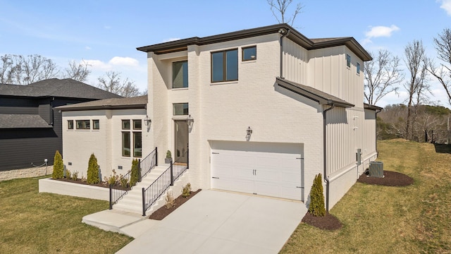 1825 River Breeze Dr, Soddy Daisy, TN 37379 - view of front of property featuring brick siding, central air condition unit, a front yard, driveway, and an attached garage