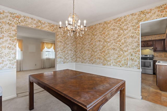 dining room featuring a wainscoted wall, wallpapered walls, ornamental molding, light colored carpet, and a chandelier