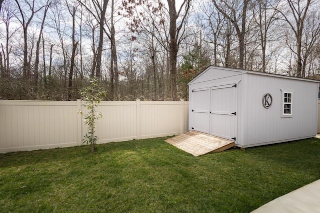 view of shed with a fenced backyard