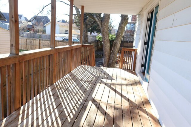 deck featuring a residential view and fence