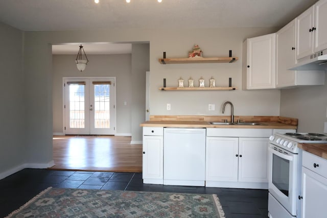 kitchen featuring a sink, french doors, white appliances, and wooden counters