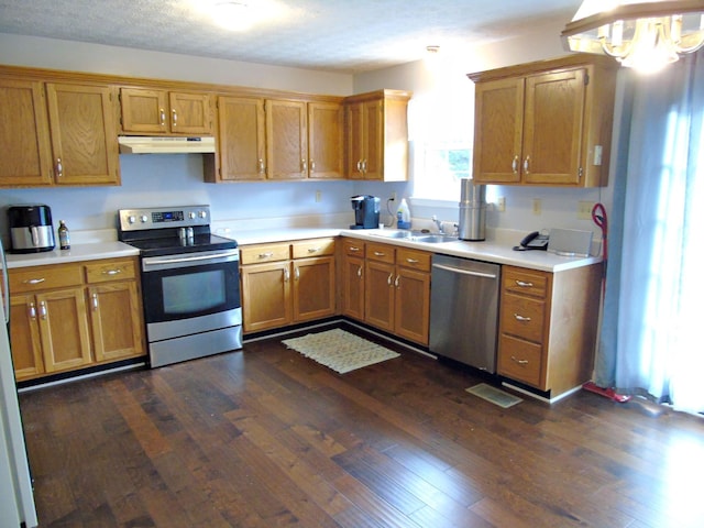 155 Spring Valley Ln, Ringgold, GA 30736 - kitchen featuring stainless steel appliances, under cabinet range hood, a sink, dark wood-style floors, and light countertops