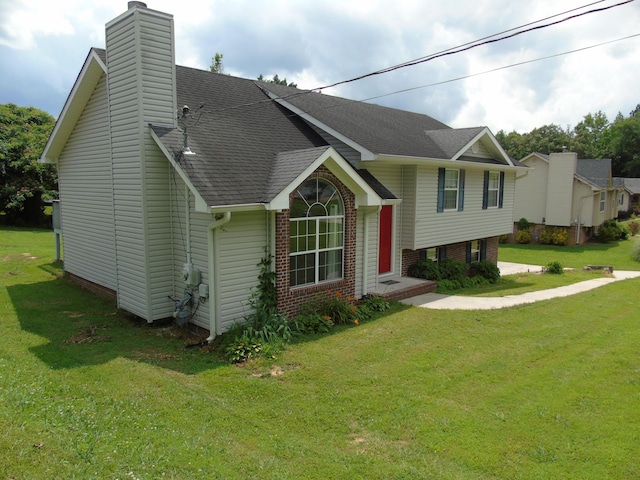 155 Spring Valley Ln, Ringgold, GA 30736 - view of front of house with a front yard, a chimney, roof with shingles, and brick siding