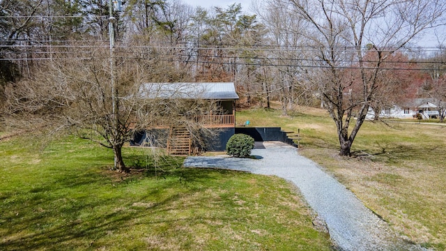 exterior space with stairs and driveway