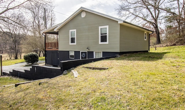 view of property exterior with a yard