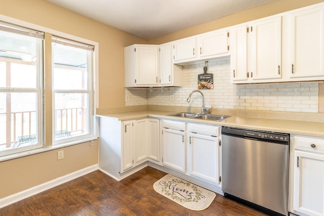 kitchen featuring a sink, white cabinets, dark wood-type flooring, and stainless steel dishwasher