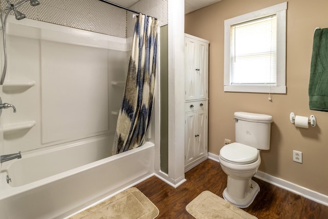 full bathroom featuring toilet, shower / tub combo with curtain, baseboards, and wood finished floors