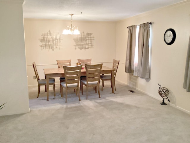 2813 Nile Rd, Chattanooga, TN 37421 - dining area featuring a chandelier, baseboards, and carpet floors