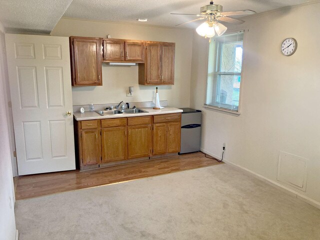 2813 Nile Rd, Chattanooga, TN 37421 - kitchen with brown cabinets, refrigerator, a sink, ceiling fan, and light countertops