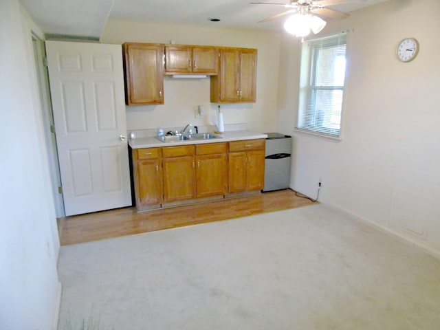 2813 Nile Rd, Chattanooga, TN 37421 - kitchen featuring a sink, brown cabinets, refrigerator, ceiling fan, and light countertops