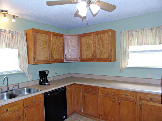 2813 Nile Rd, Chattanooga, TN 37421 - kitchen featuring a sink, brown cabinetry, light countertops, and dishwasher