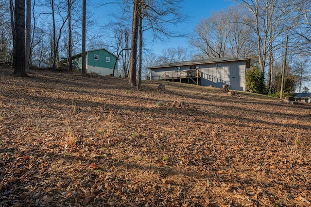 view of yard featuring a wooden deck