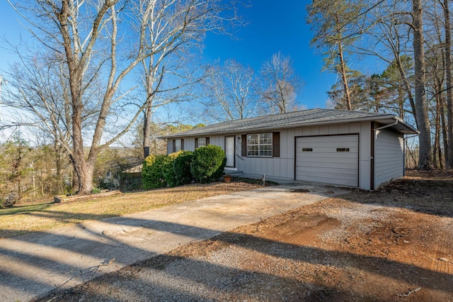 ranch-style home featuring board and batten siding, concrete driveway, and a garage