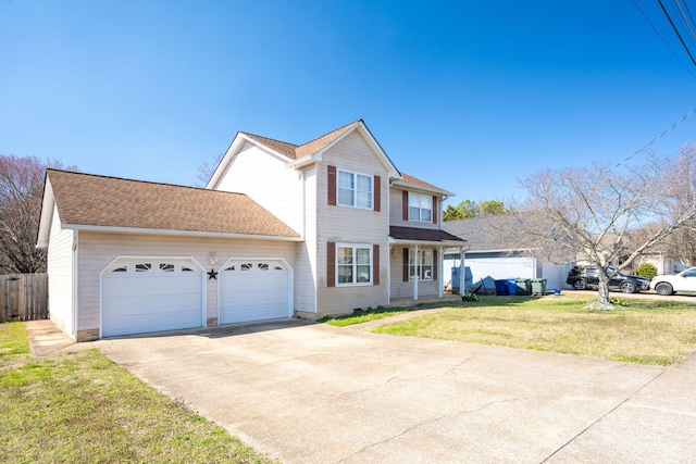 traditional-style house featuring a garage, concrete driveway, a front yard, and fence