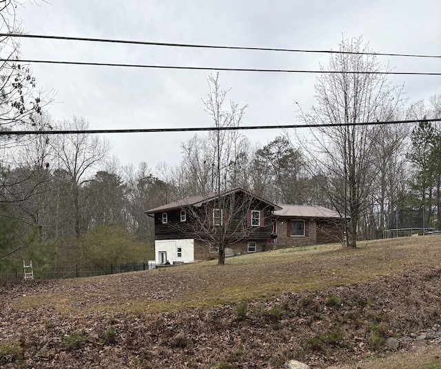 view of front of property featuring fence