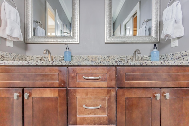 bathroom with double vanity and a sink