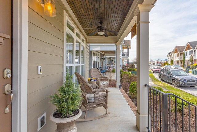 view of patio / terrace featuring a residential view, covered porch, and ceiling fan