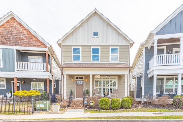 view of front of property with a porch, central AC unit, fence, and board and batten siding