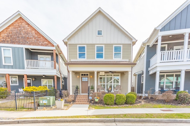 view of front of house with a porch, fence, central AC unit, and board and batten siding