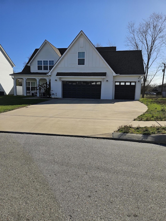 view of front facade featuring board and batten siding and driveway