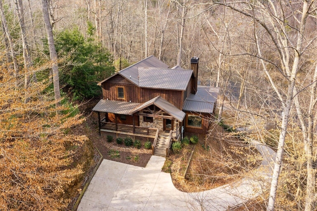 exterior space with a forest view