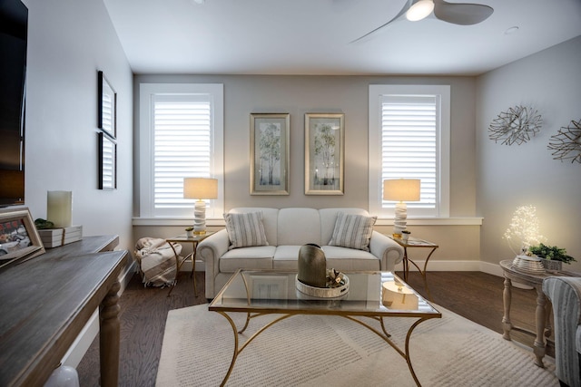 living room featuring a wealth of natural light, a ceiling fan, and wood finished floors