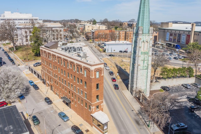 birds eye view of property featuring a city view