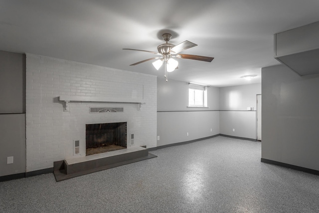 unfurnished living room with a ceiling fan, visible vents, a fireplace, and baseboards