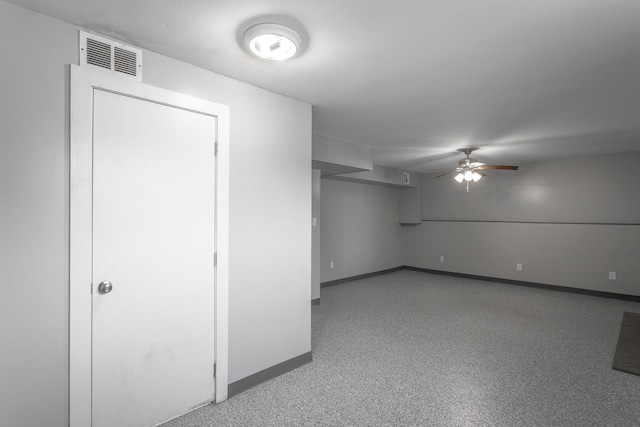 empty room with visible vents, baseboards, and a ceiling fan