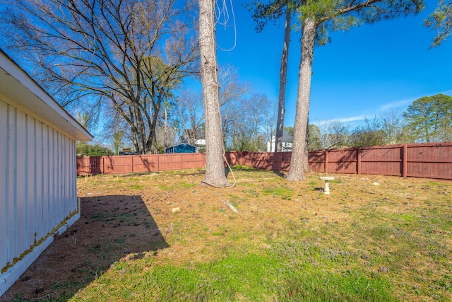 view of yard with a fenced backyard