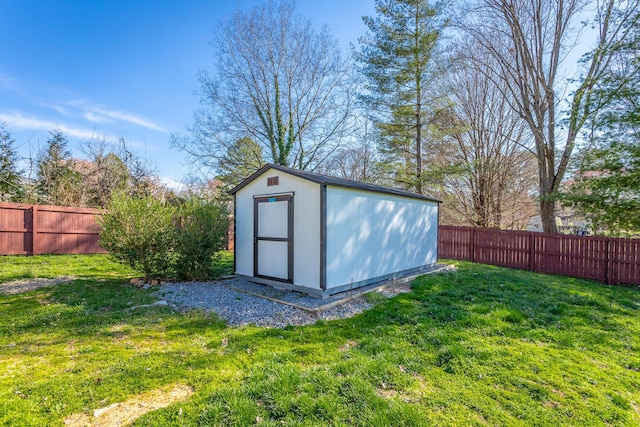 view of shed with a fenced backyard