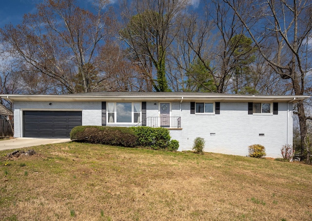 ranch-style house featuring crawl space, driveway, brick siding, and a front yard