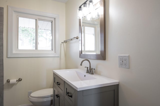 half bath with toilet and vanity