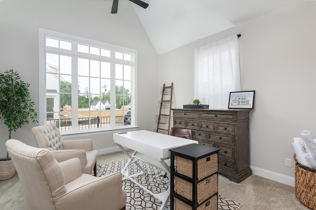 office space with baseboards, high vaulted ceiling, light carpet, and ceiling fan