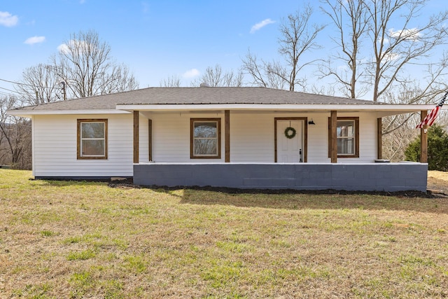 view of front of property with a porch, a front yard, and a shingled roof