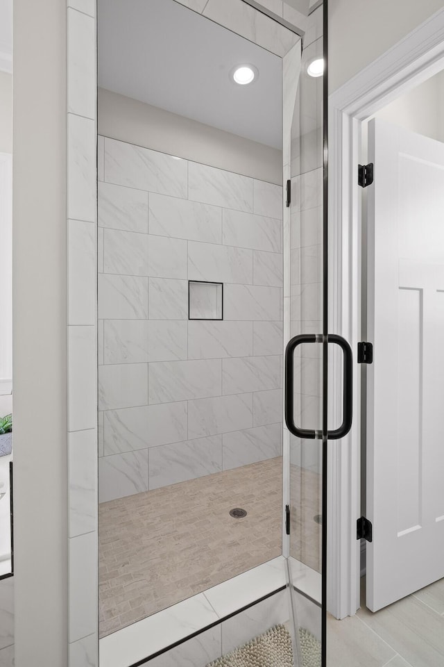 bathroom with a shower stall