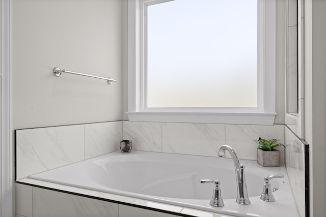 bathroom with a garden tub