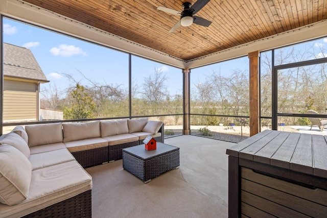 sunroom / solarium with wood ceiling and ceiling fan