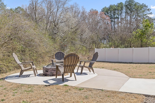 view of patio / terrace featuring an outdoor fire pit and fence