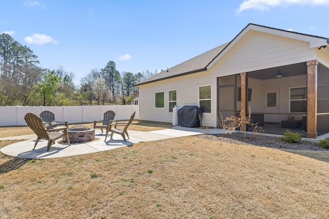 view of yard featuring fence private yard, a patio area, and an outdoor fire pit