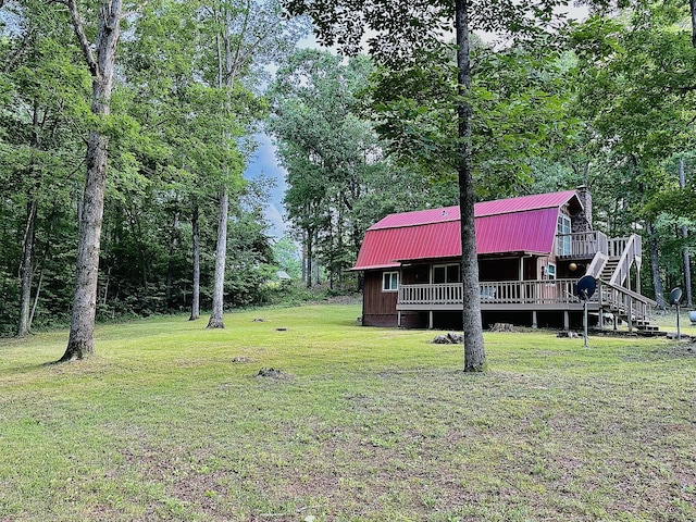 142 Huckleberry Trl, Lafayette, GA 30728 - view of green lawn with a wooden deck and stairs