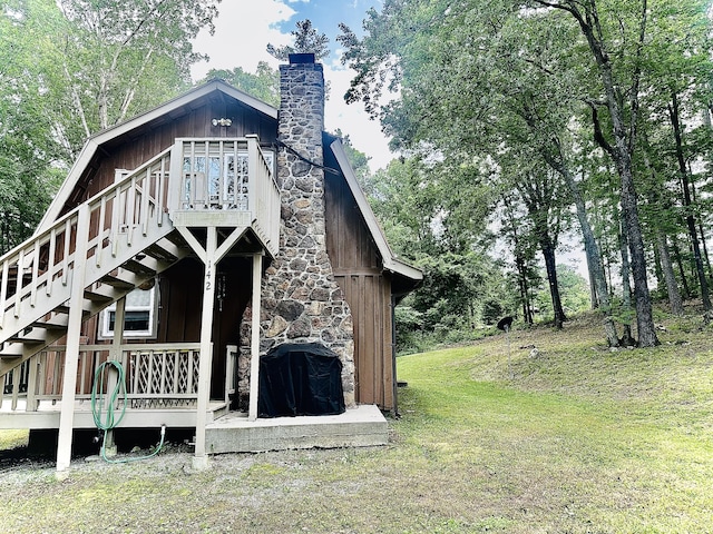 142 Huckleberry Trl, Lafayette, GA 30728 - back of house with stairway, a chimney, a lawn, and a wooden deck