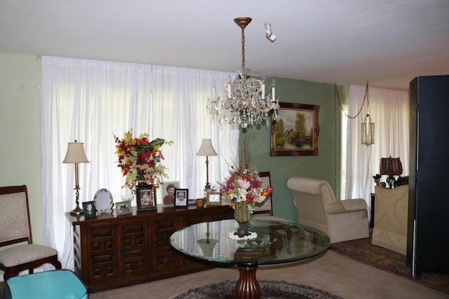 dining area featuring an inviting chandelier