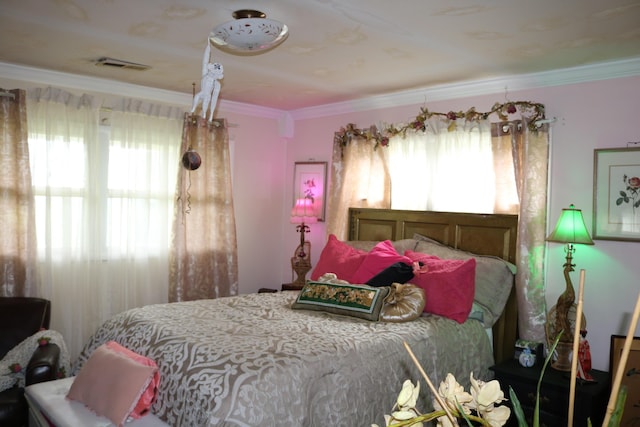 bedroom featuring visible vents and ornamental molding