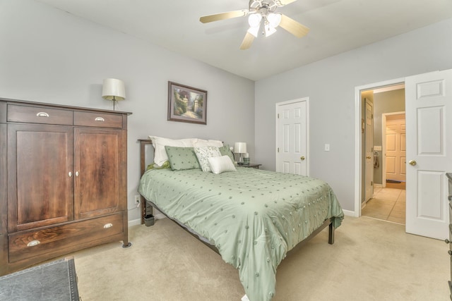 bedroom with light carpet, a ceiling fan, and baseboards